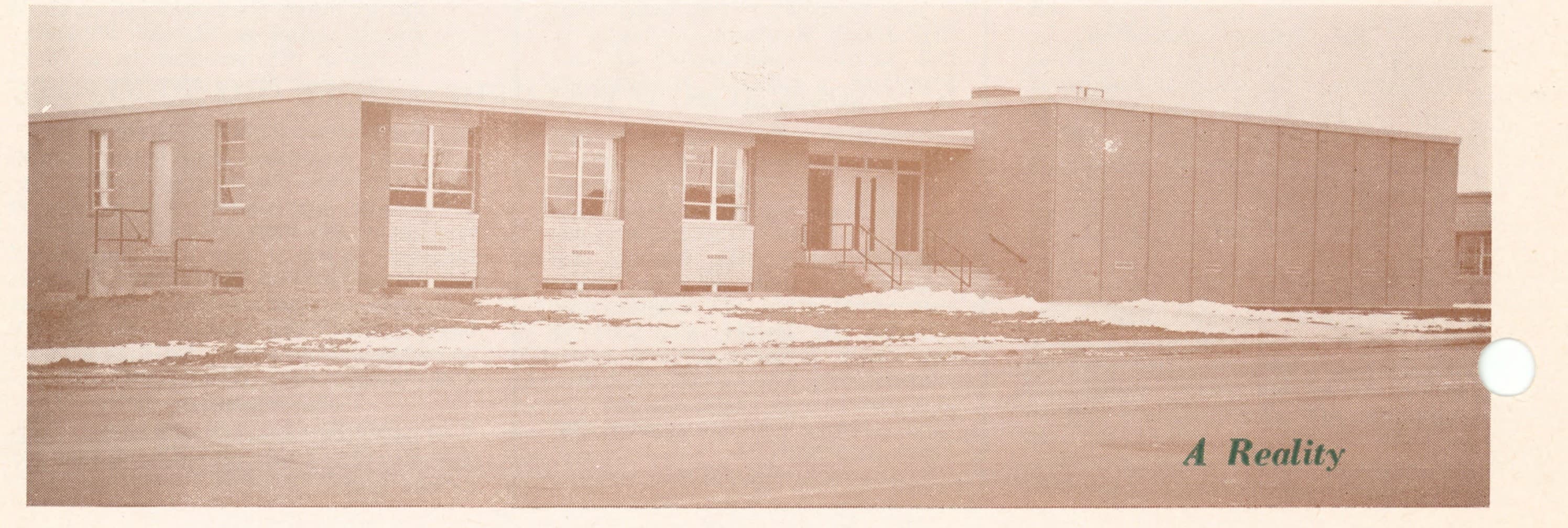 Exterior photograph of the new CHSAA office building, labeled A Reality