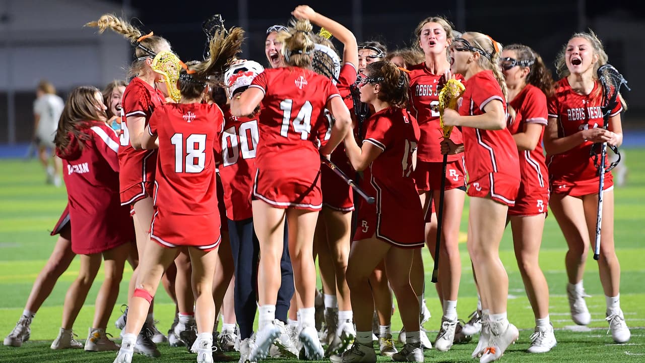 Regis Jesuit celebrates after winning the 5A semifinal to advance to the state championship