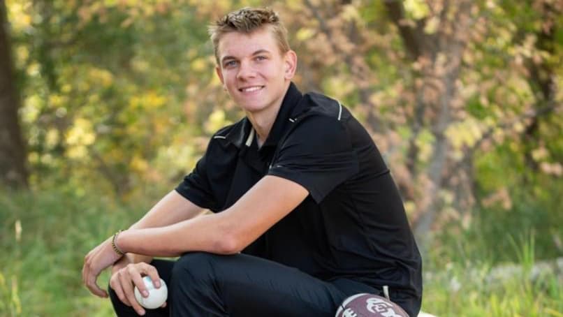 Simon Lunsford poses for a senior portrait