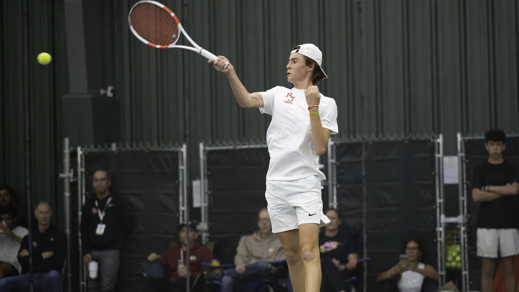 Alec Rodriguez-Fields hits a forehand at the 2024 CHSAA boys state tennis tournament.