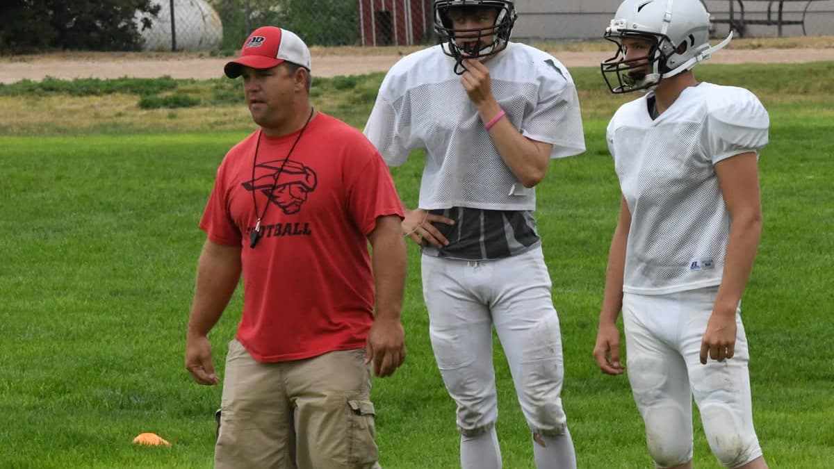 Toby Kechter coaching his Idalia 6-man football team at practice