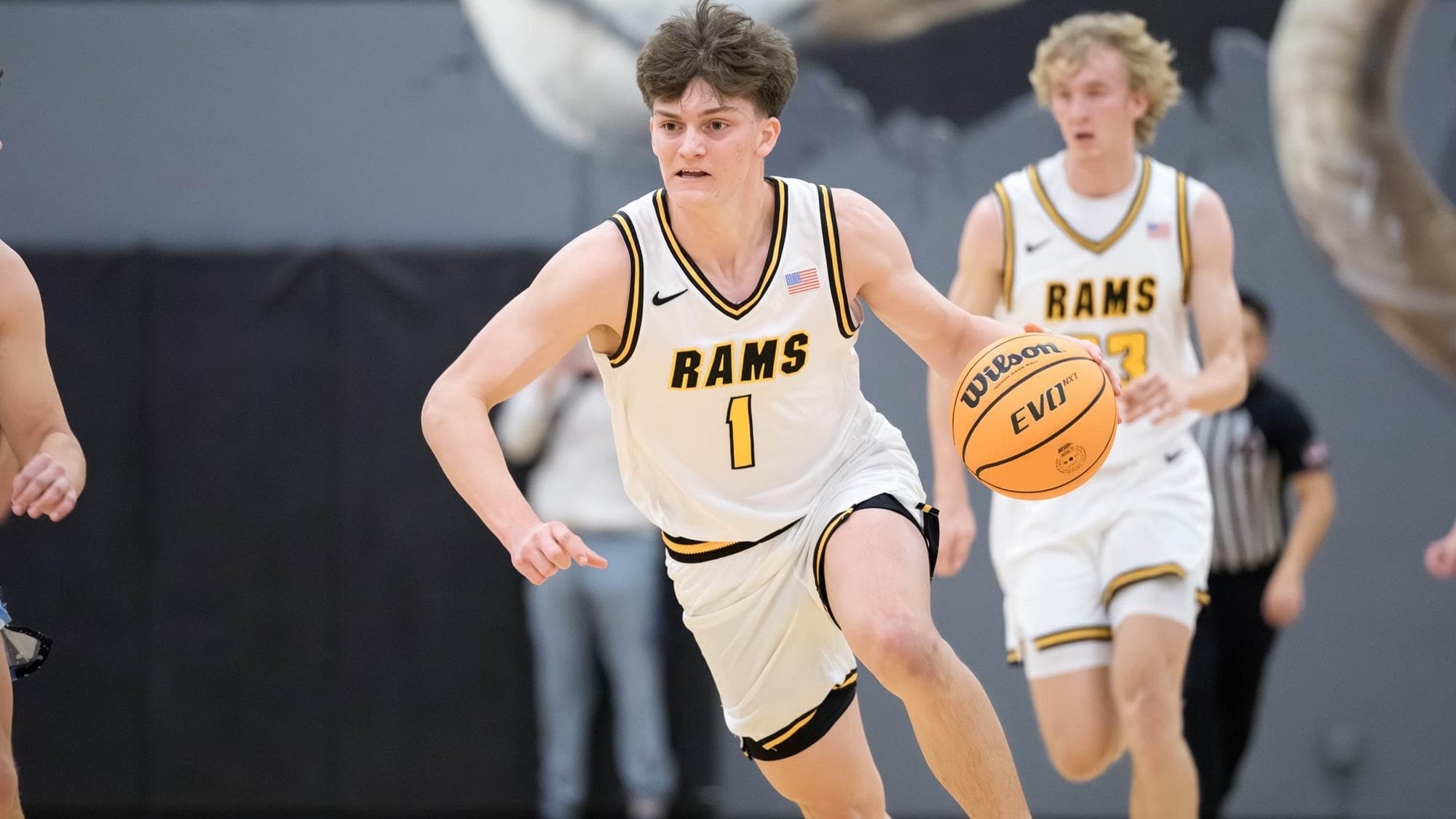 Green Mountain's Sam Mielenz dribbling a basketball
