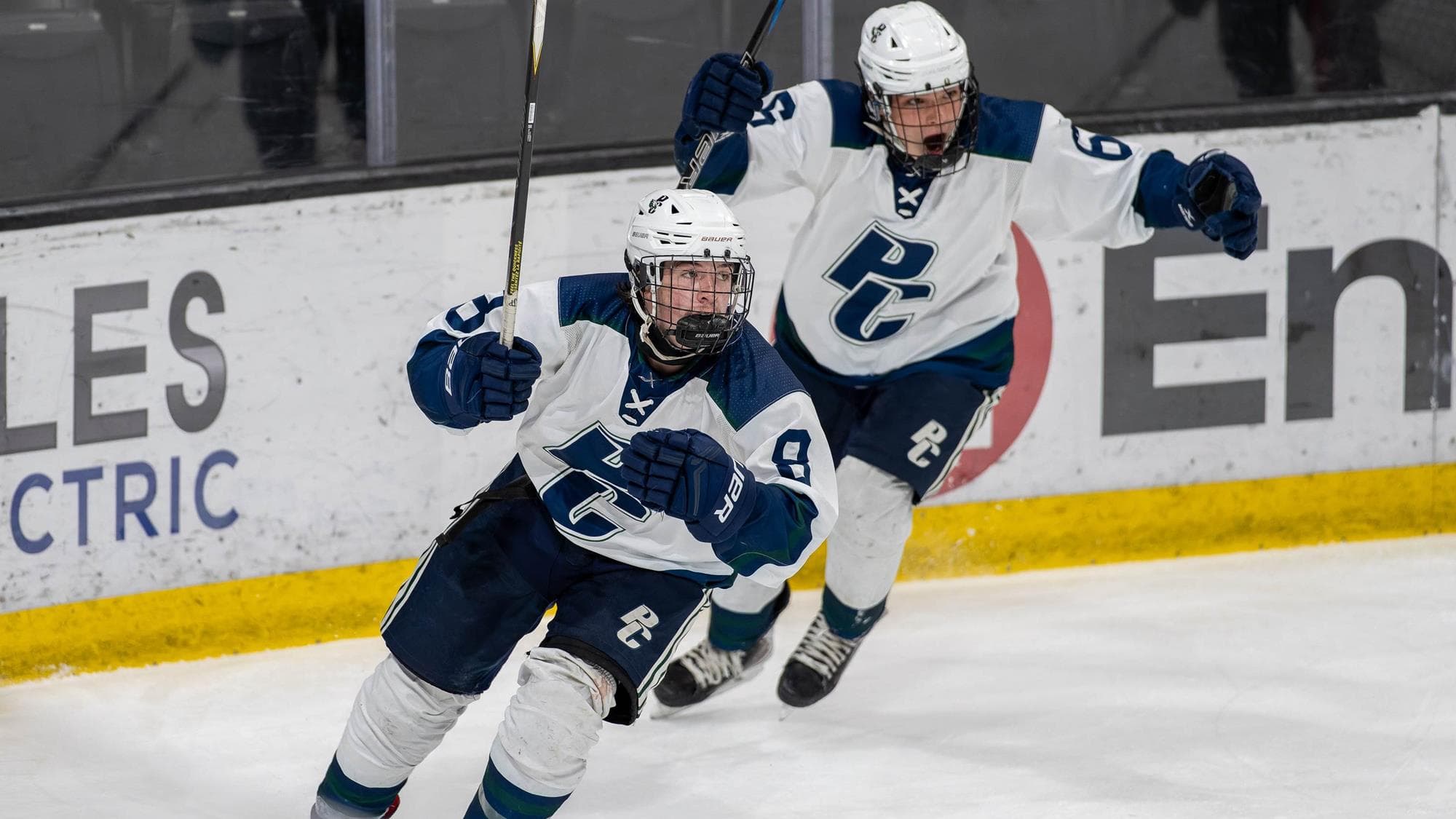 Pine Creek hockey player Riley Mlikto celebrates after a goal