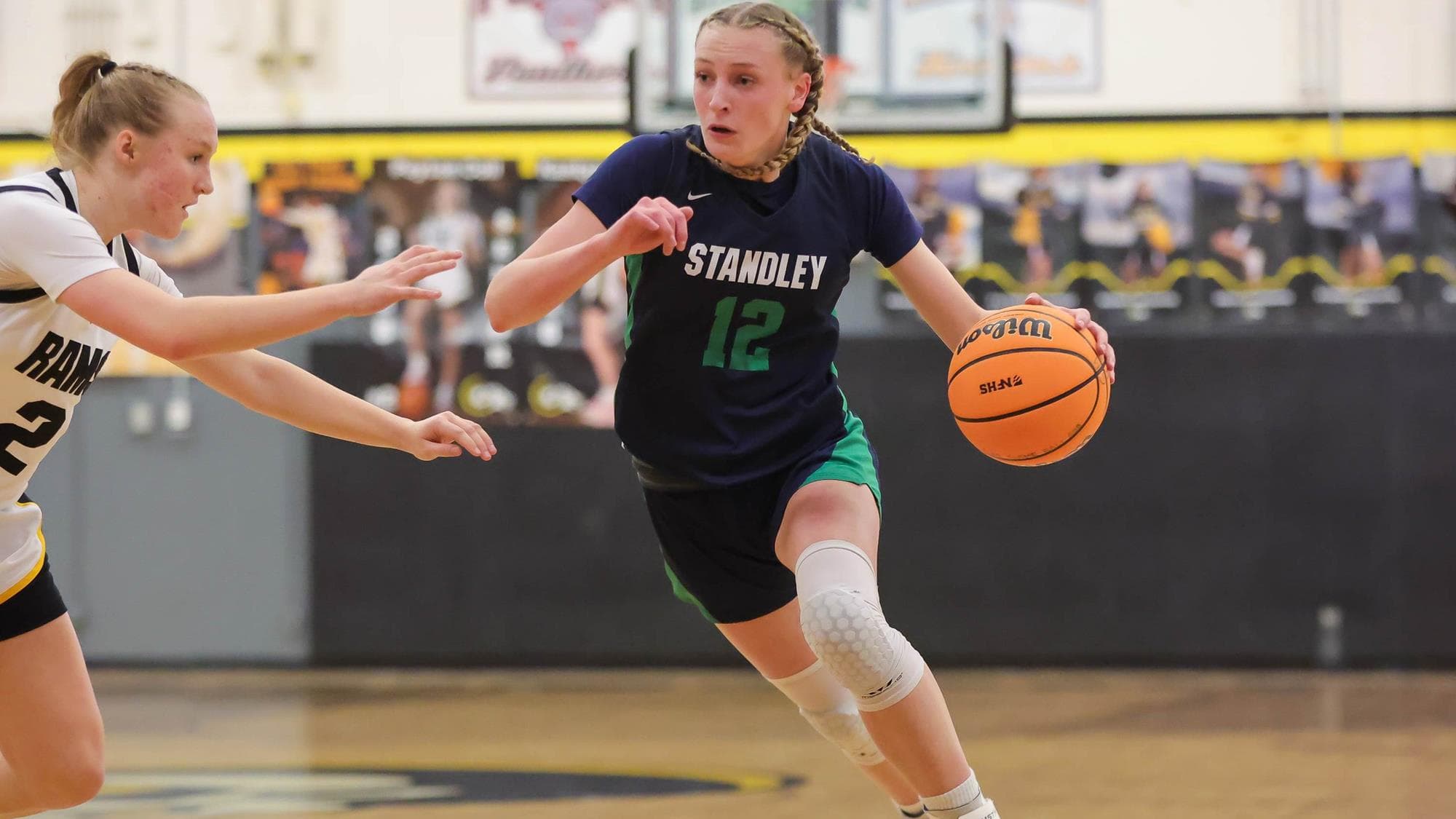 Jojo Martin of Standley Lake drives with the basketball