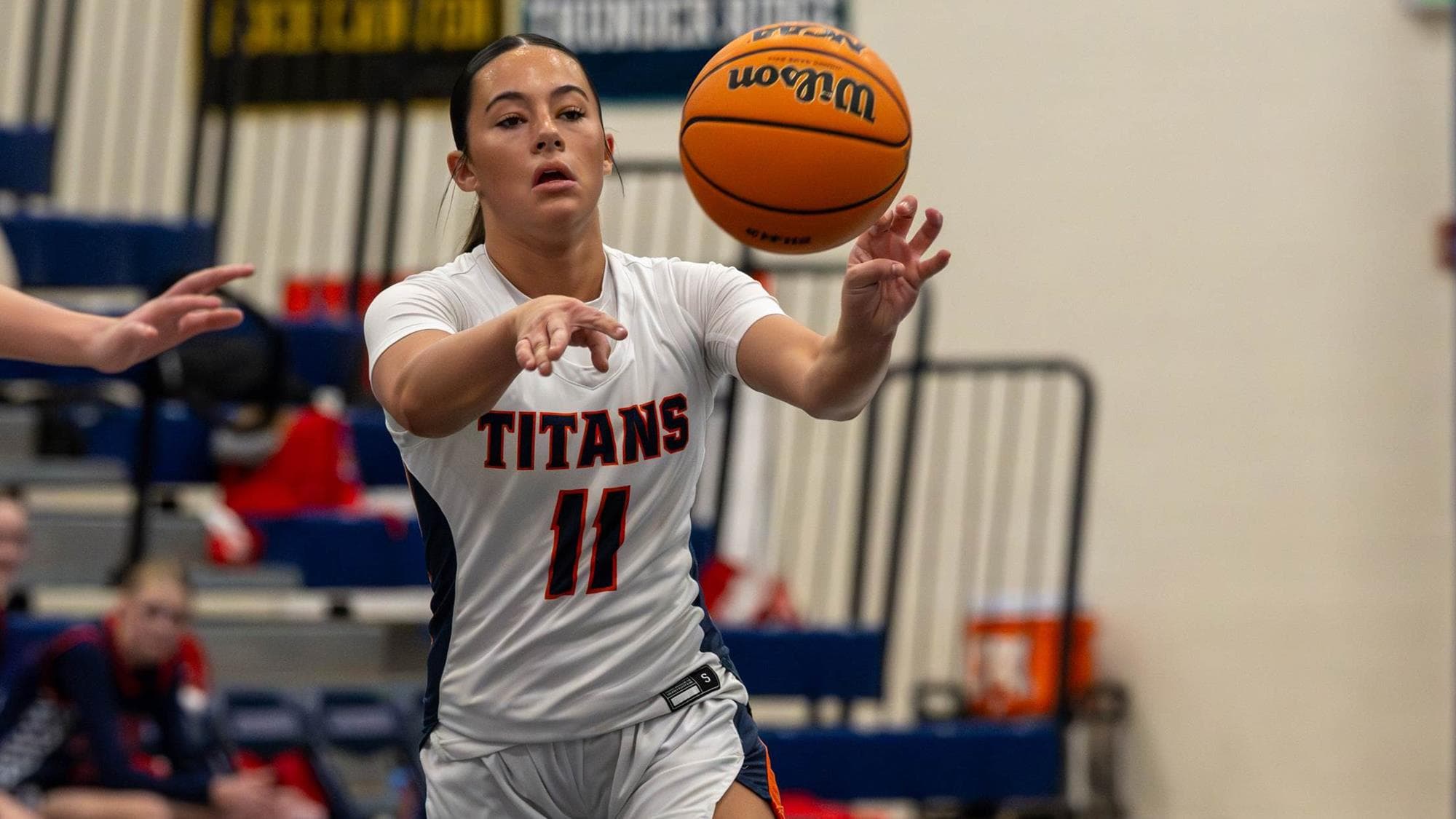 Maile Starns of Legend passing the basketball