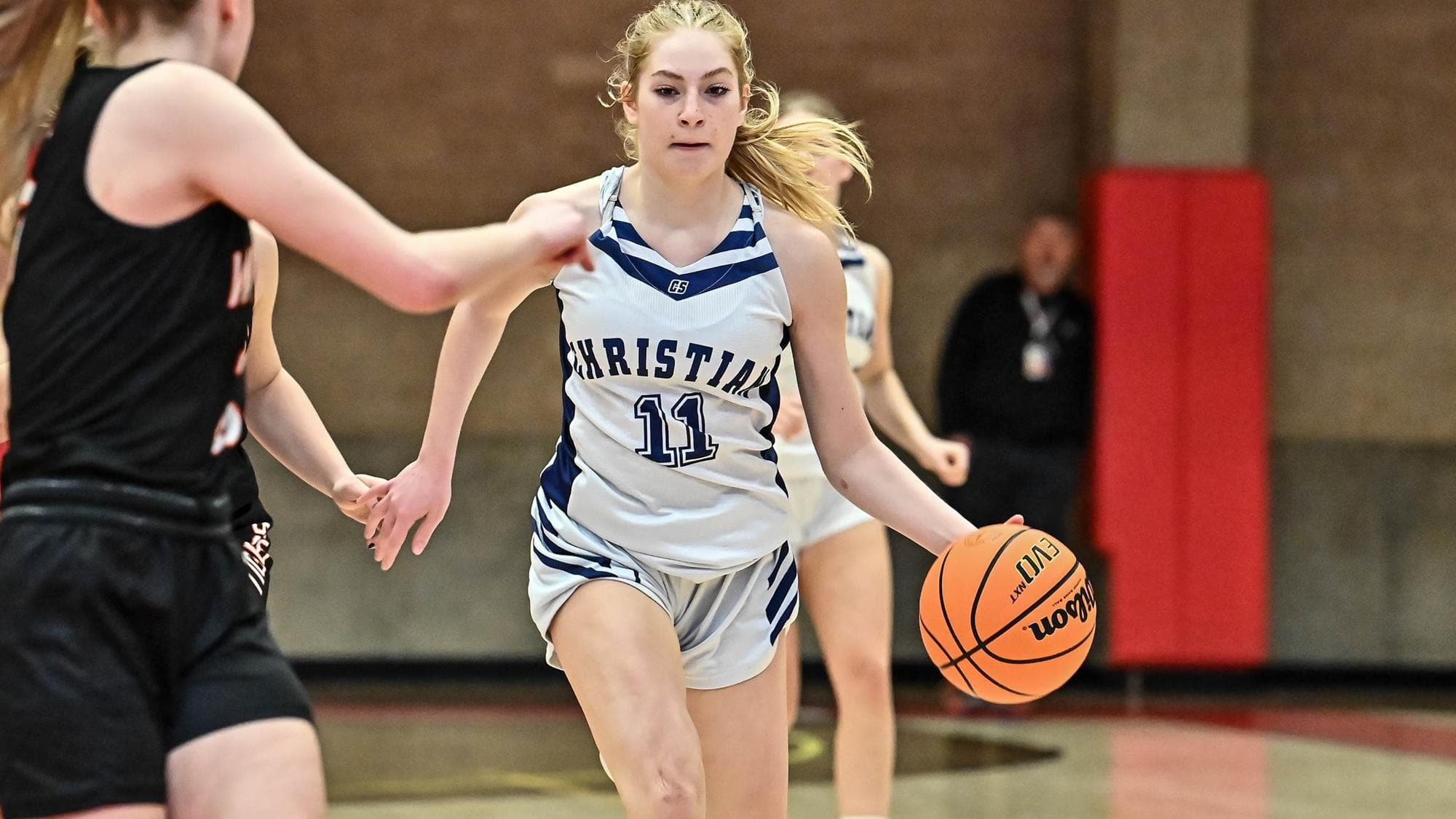 Rose Ross of Colorado Christian dribbling the basketball