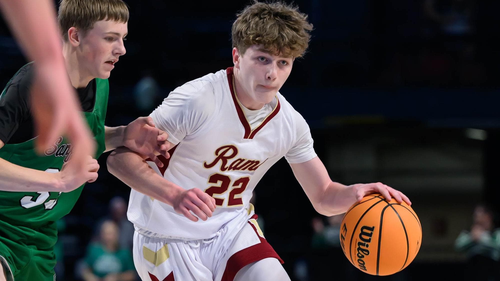 Zavier Trenkle of Merino drives with the basketball