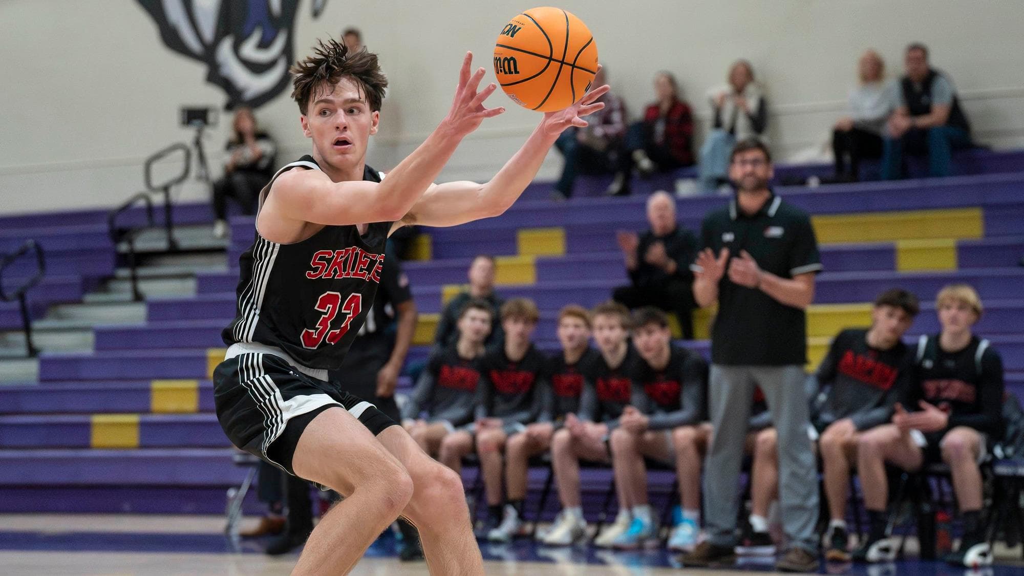 Aspen's Jack Berro reaches for the basketball