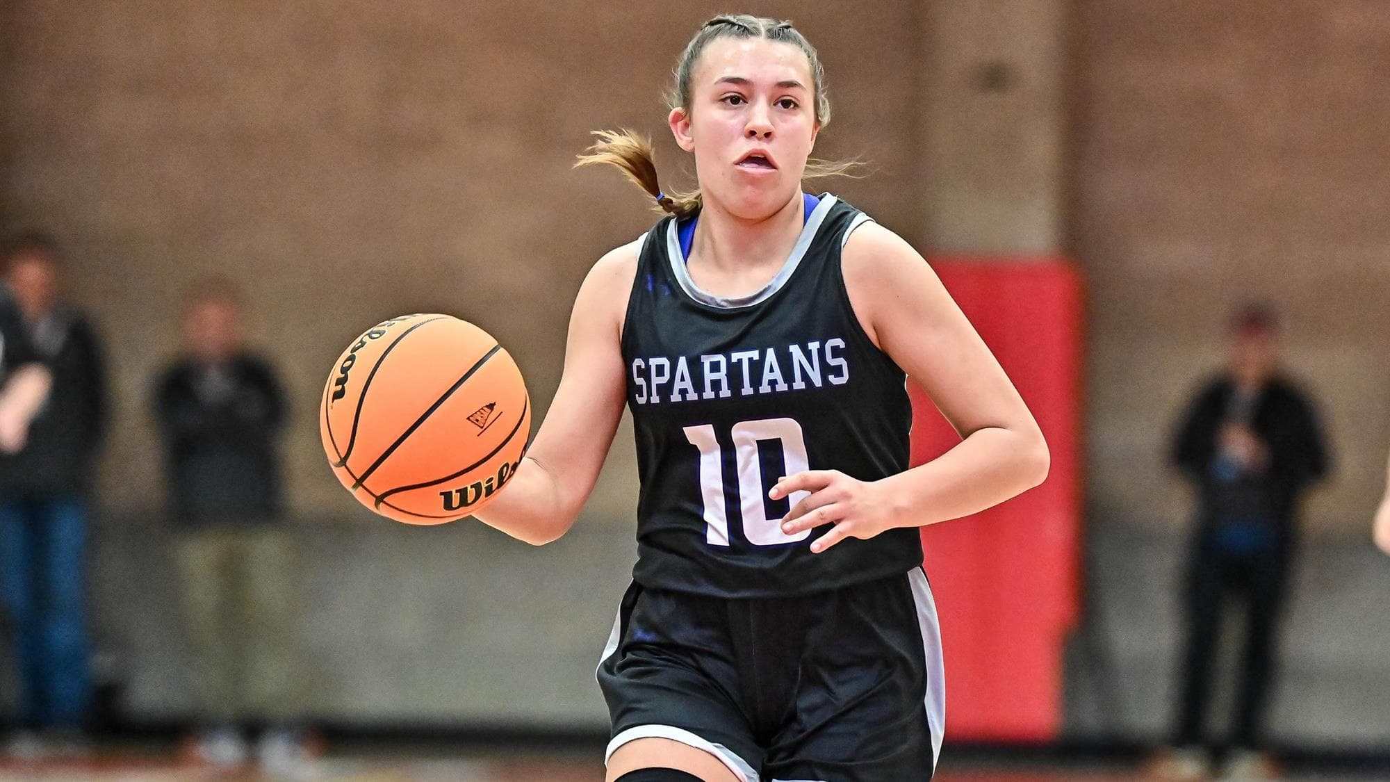 Braeden Johnson of Salida dribbles the basketball