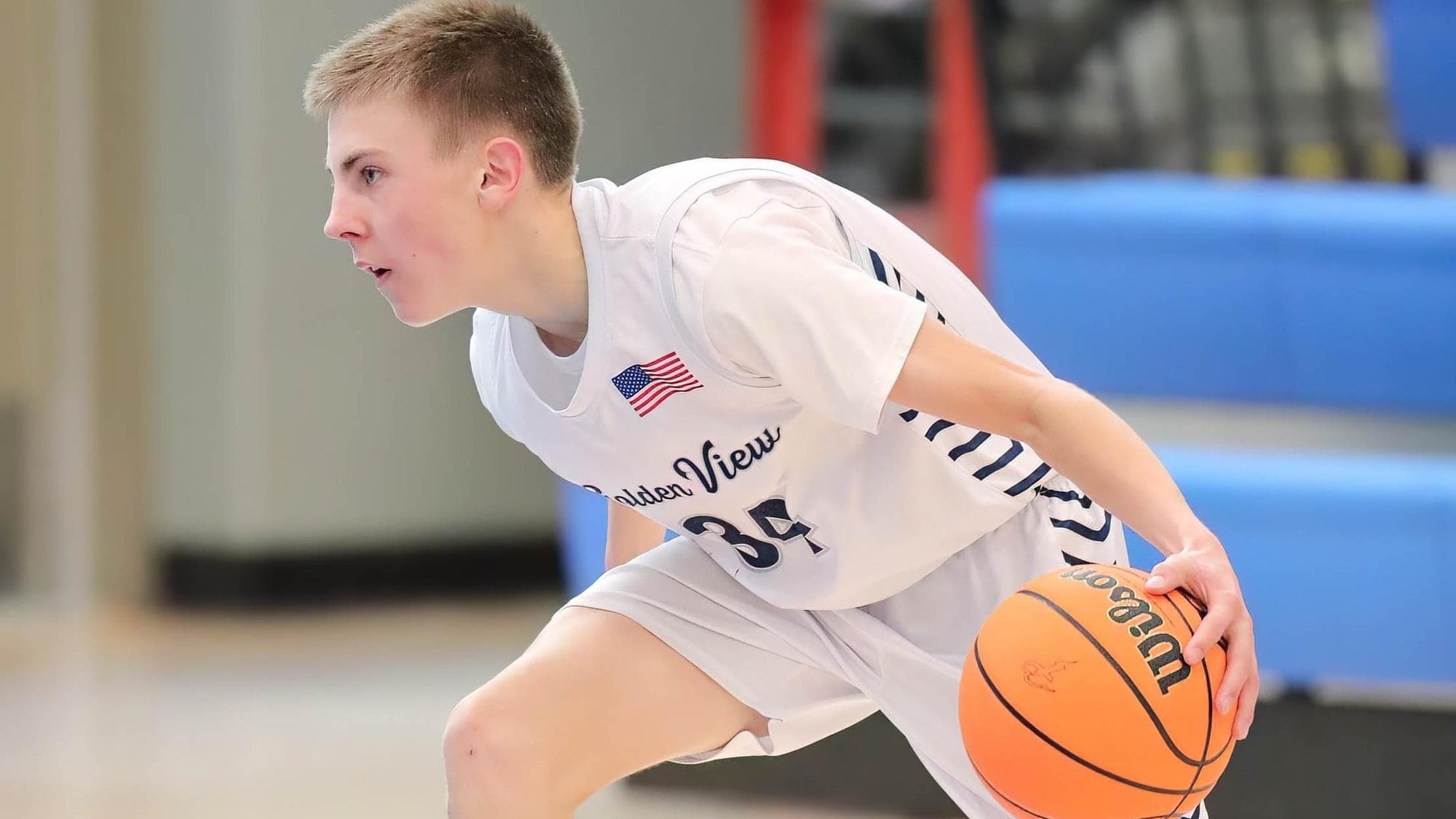 Jacob Walker of Golden View Classical Academy dribbling the basketball