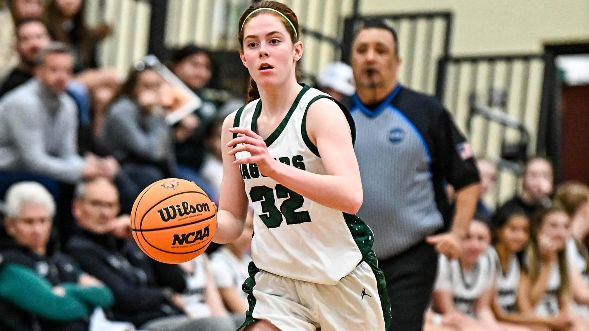 Colleen Monahan of D'Evelyn dribbling the basketball