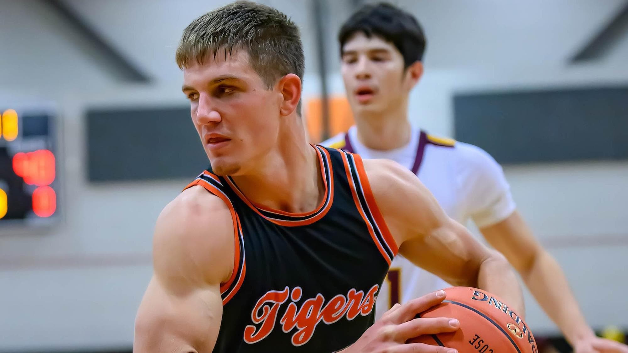Trey Scheler of Cheyenne Wells holds the basketball