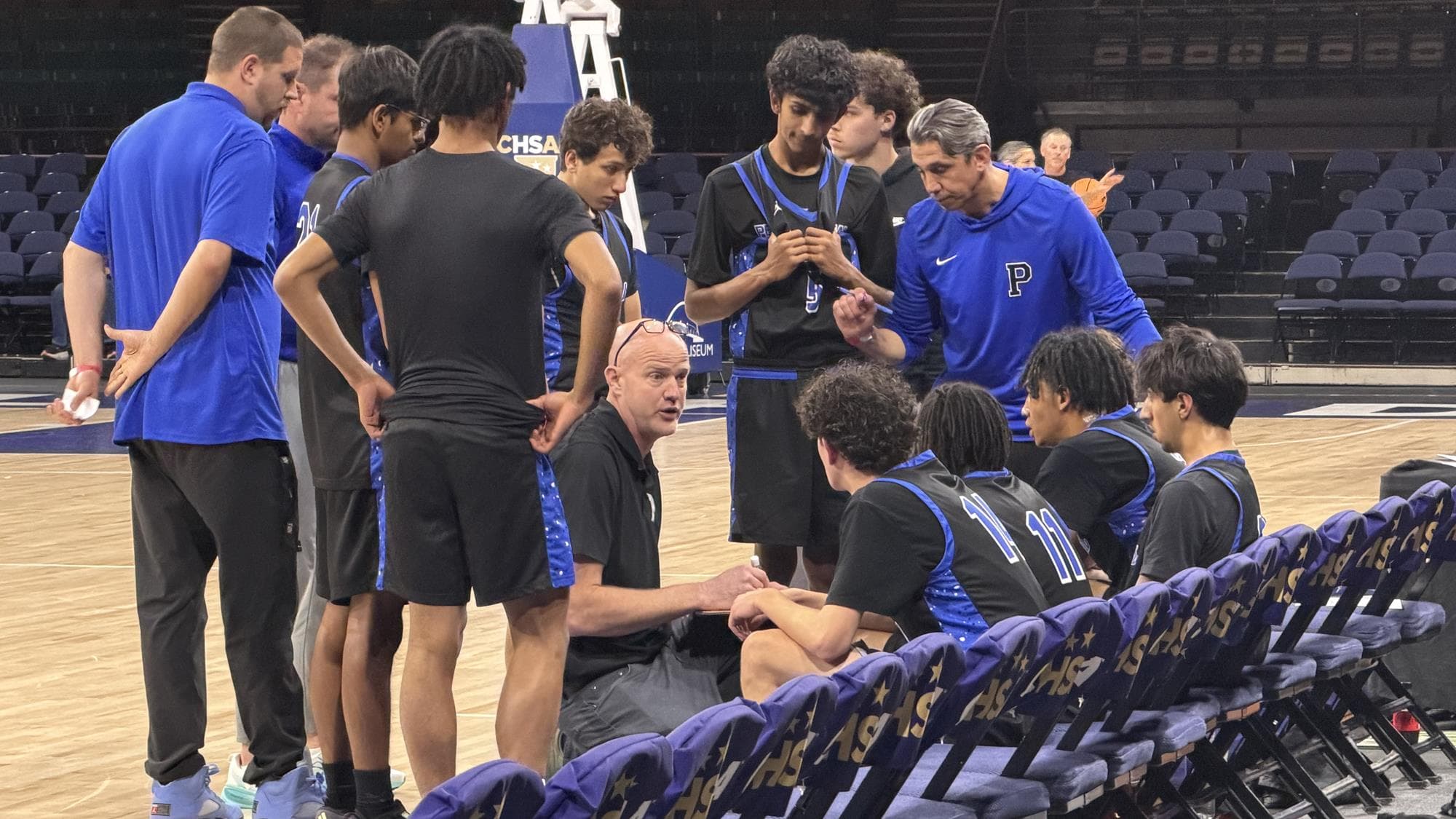 Peak to Peak coach Evan Eschmeyer in the huddle with his team