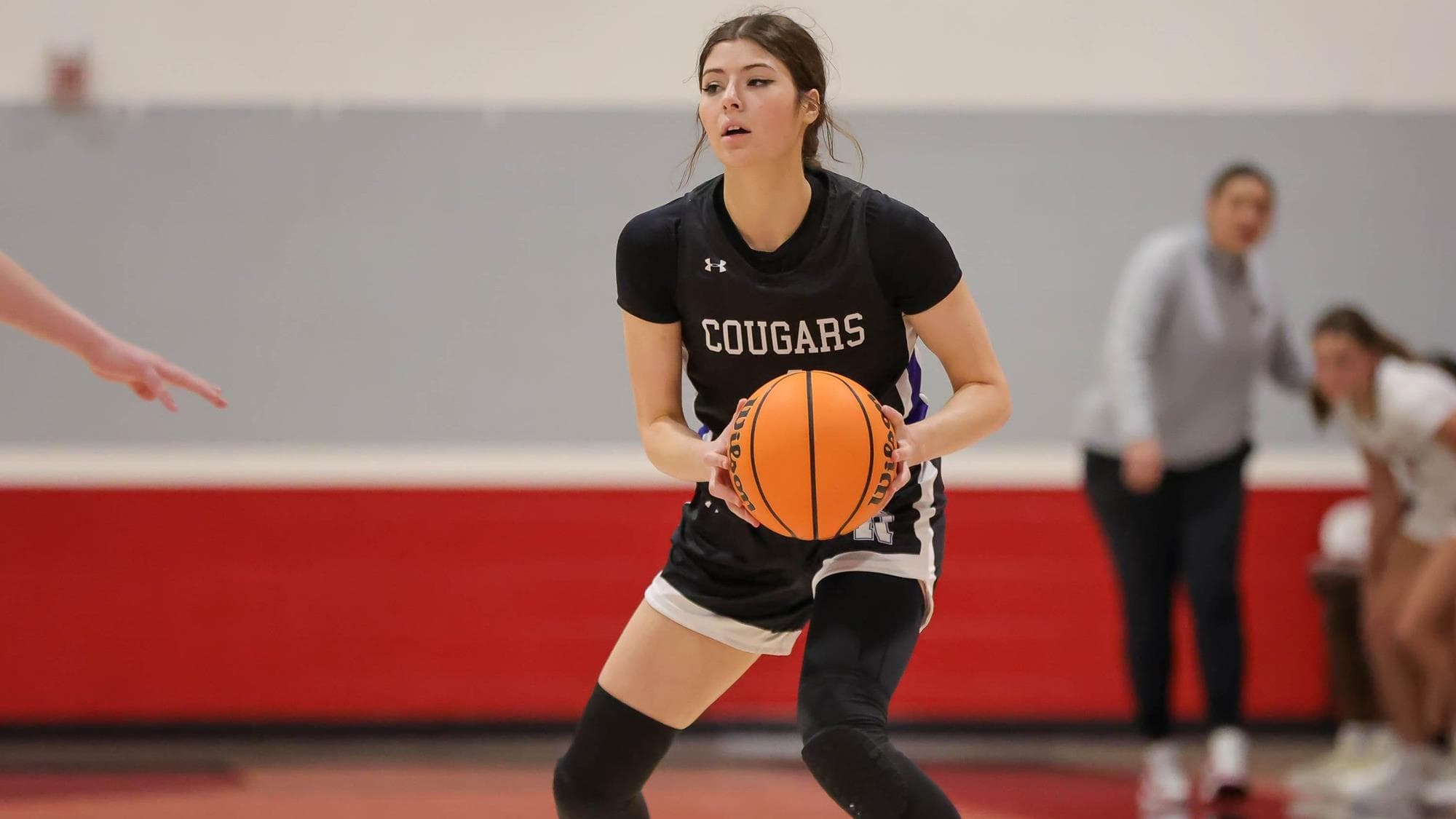 Bethany Vrooman of Resurrection Christian holds the basketball