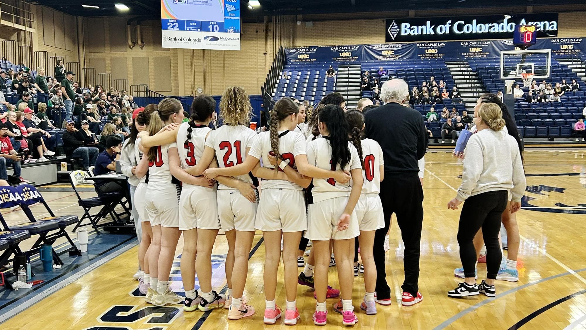 McClave girls basketball huddle