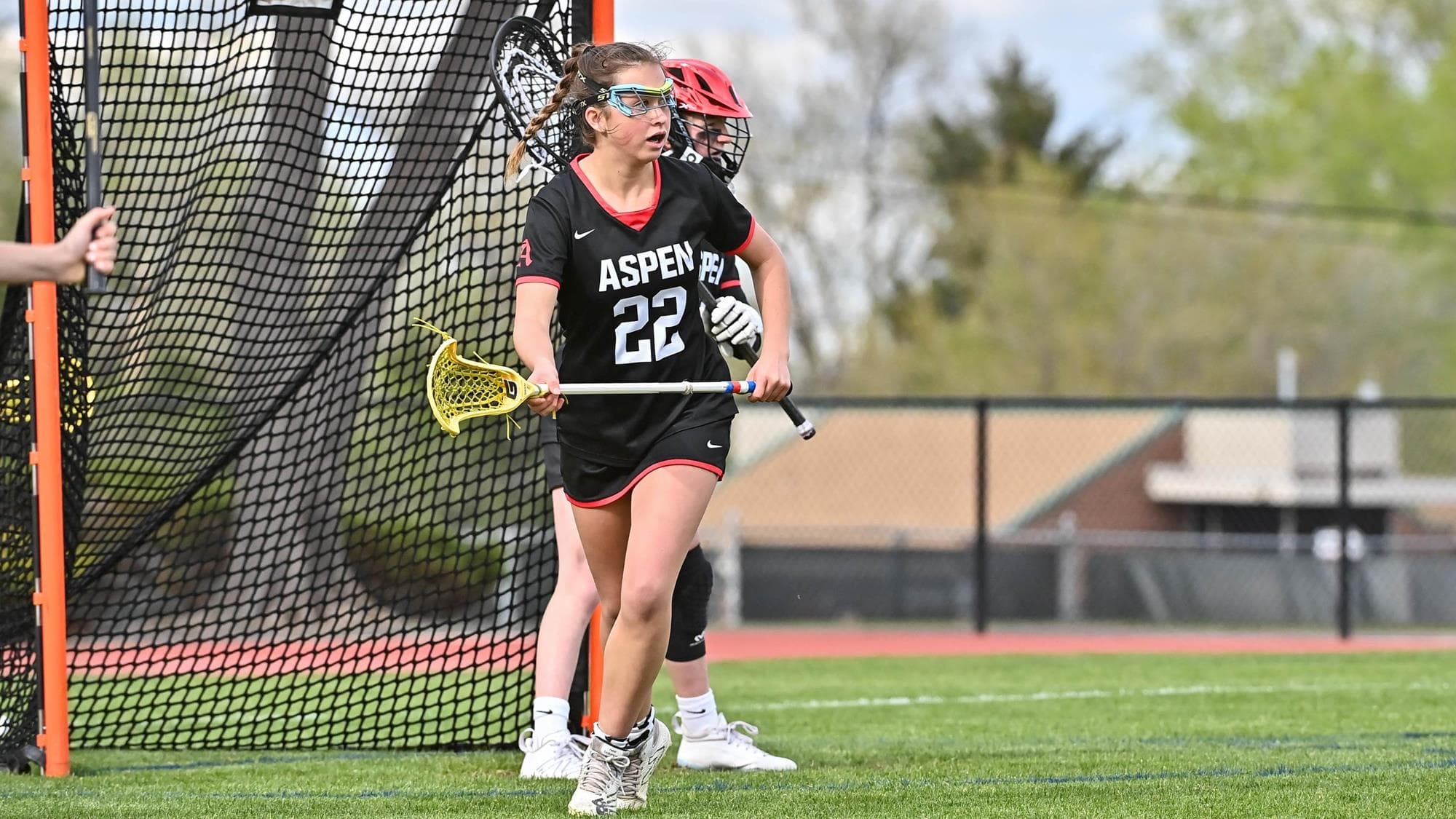 Aspen's Gigi Trani playing lacrosse