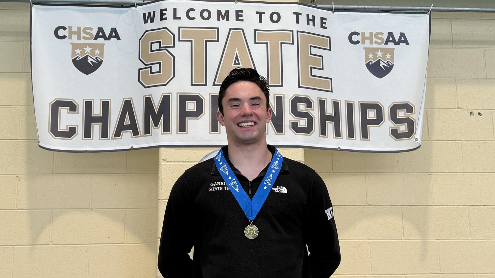 Andrew Garrison of Highlands Ranch wearing his medal after winning the 5A boys diving state championship