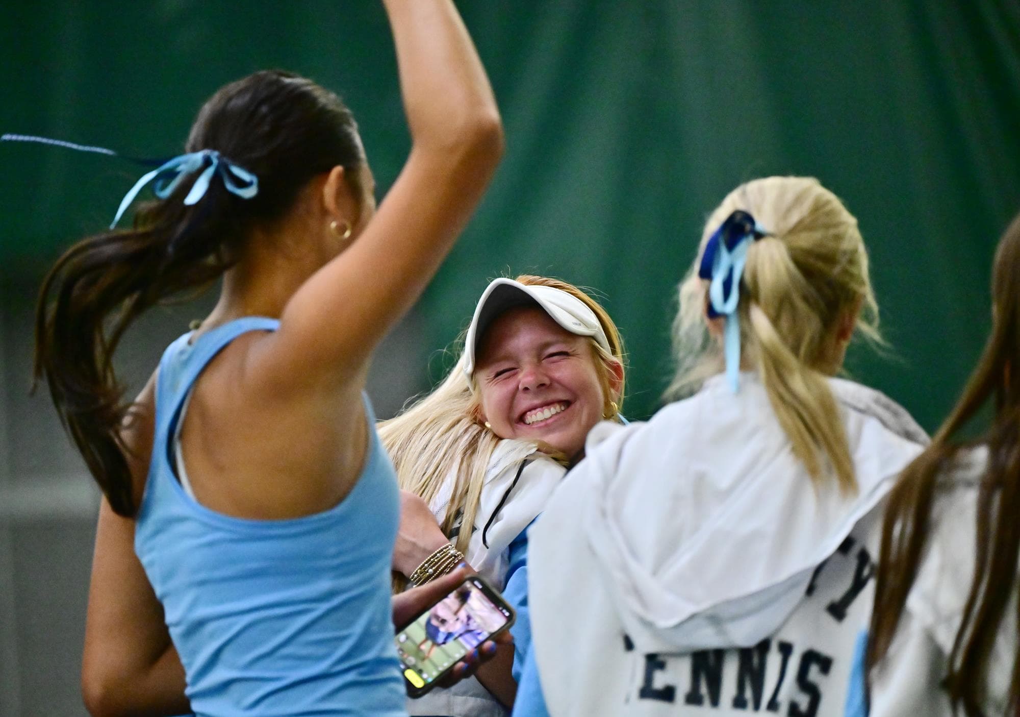 Caroline Daugherty celebrates after winning her third straight 5A state tennis championship in No. 1 singles.