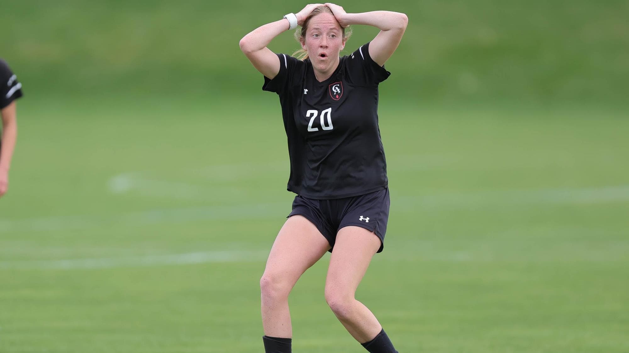 Colorado Academy's Lyla Kocher reacts with surprise with her hands on her head while playing in a girls soccer game.