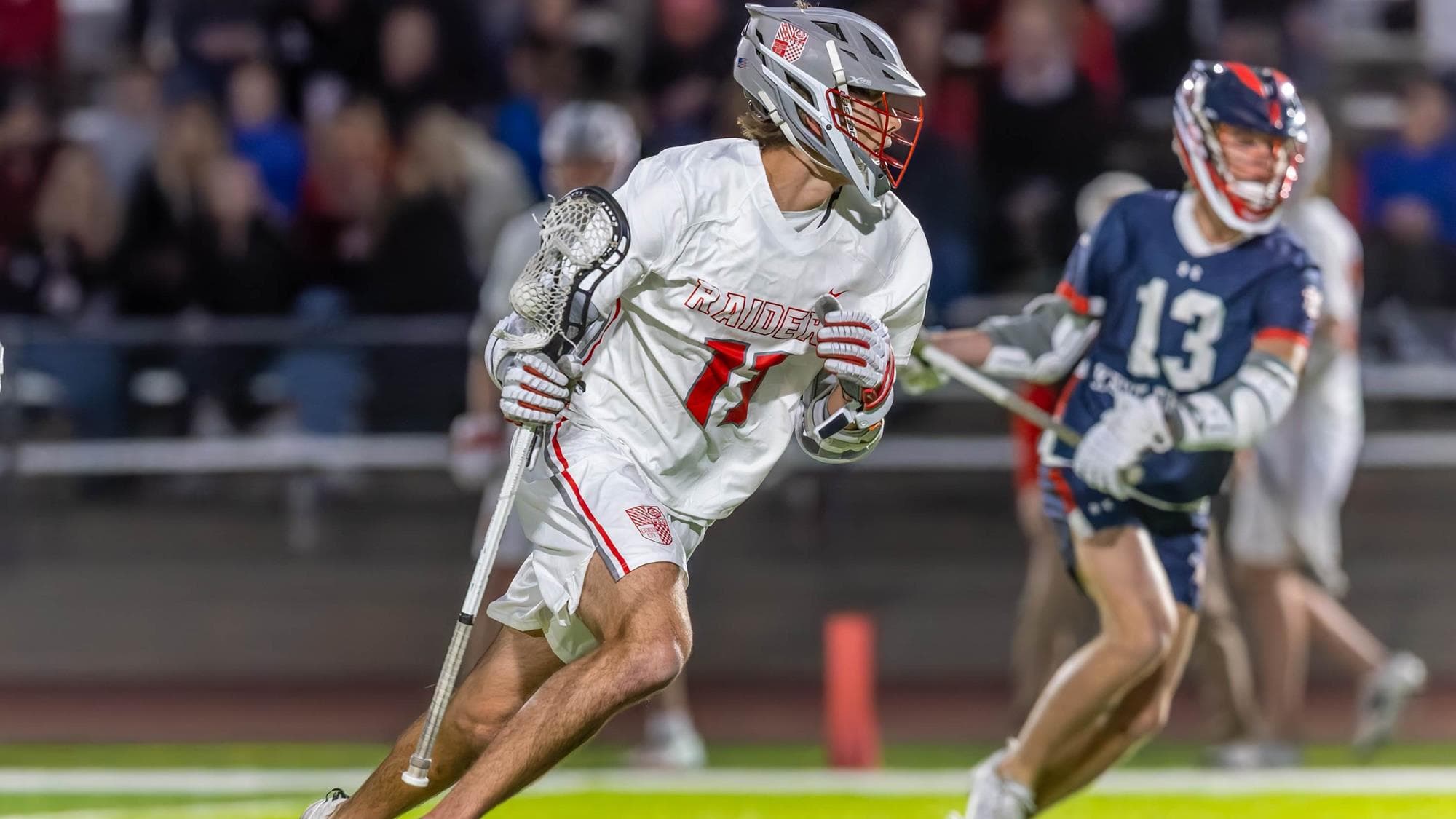 William Wilson of Regis Jesuit playing lacrosse