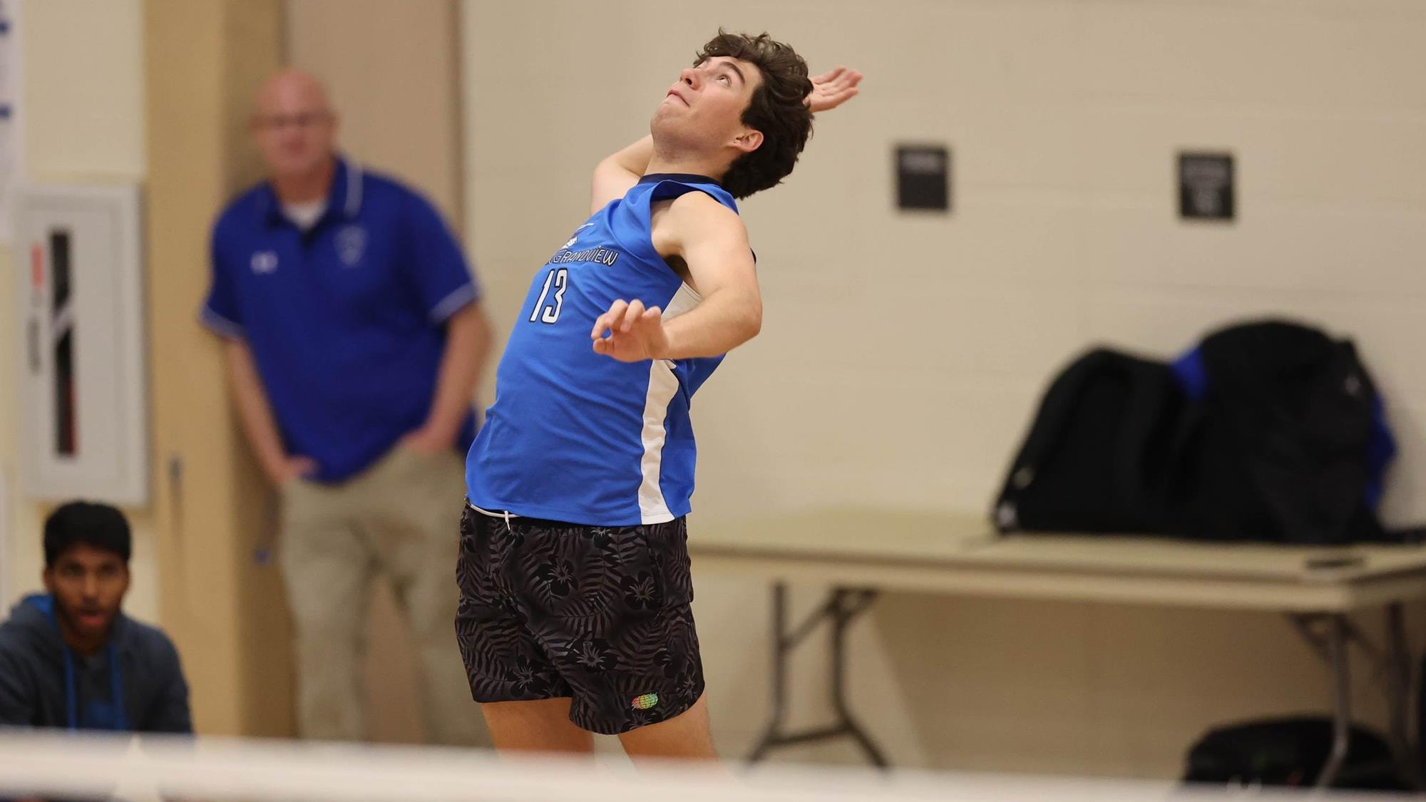 Alex Garcia of Grandview serving in volleyball