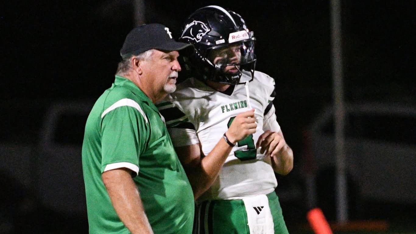 Fleming football coach John King talks to one of his players.
