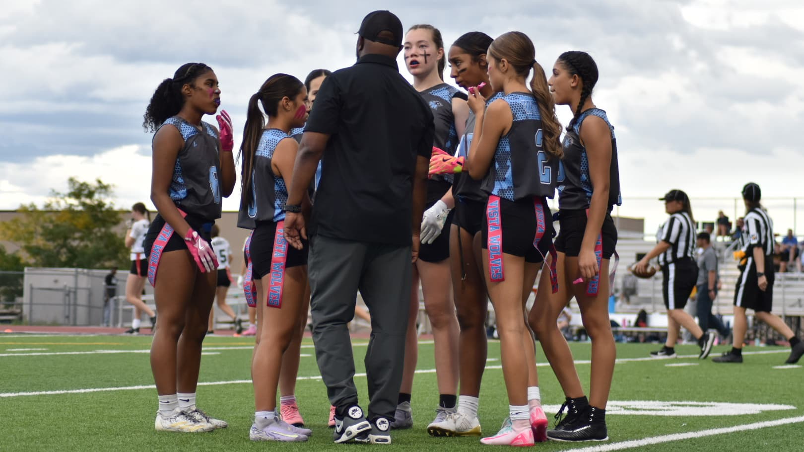 Trevas McFail coaching a group of Vista Ridge flag football players